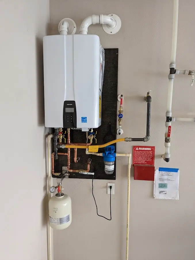 Professional plumber installing copper piping in a Dublin home